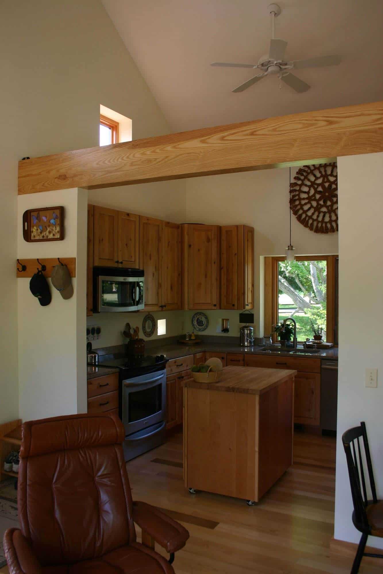 A newly built kitchen with a wooden ceiling.